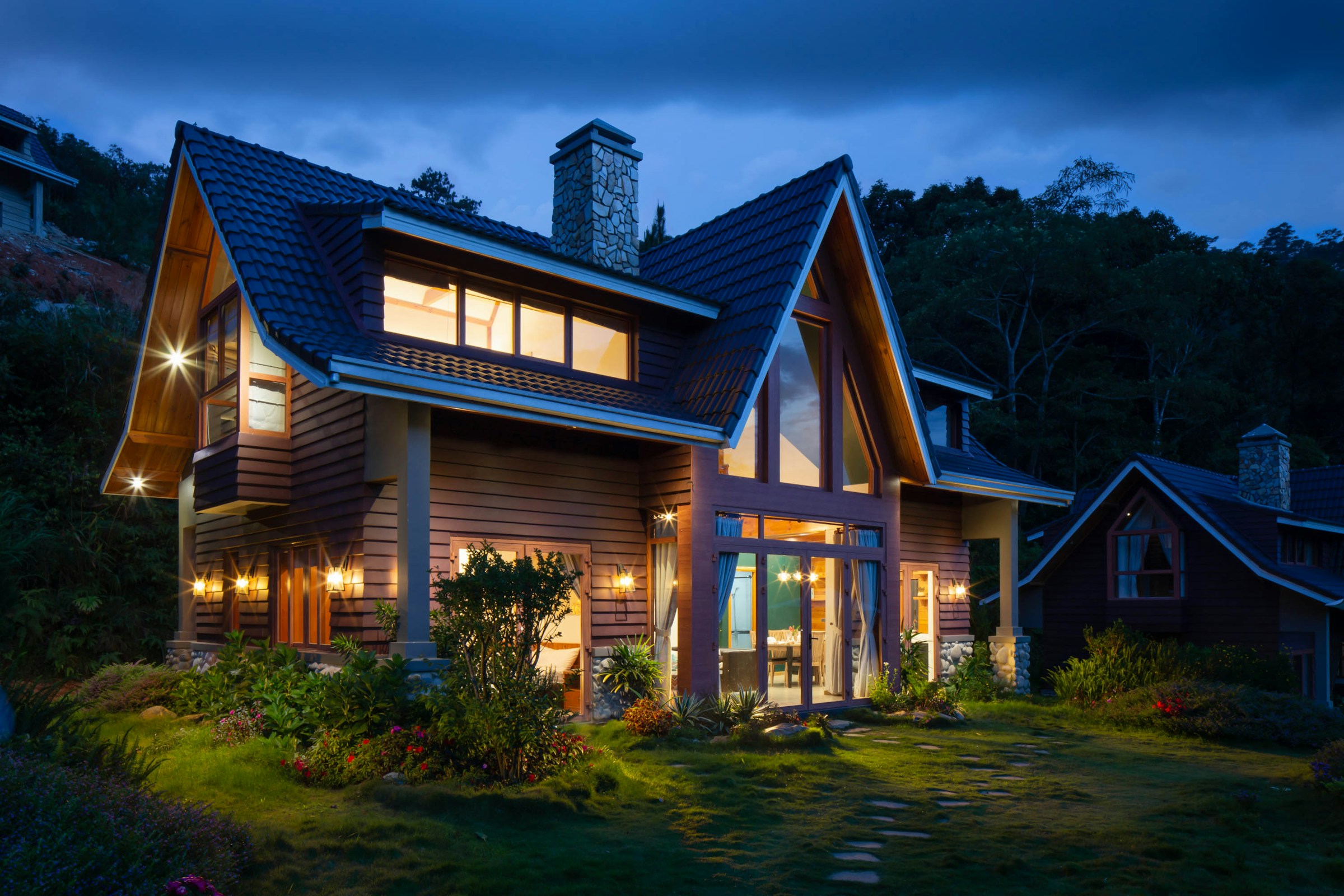 Finished residential siding replacement project at dusk
